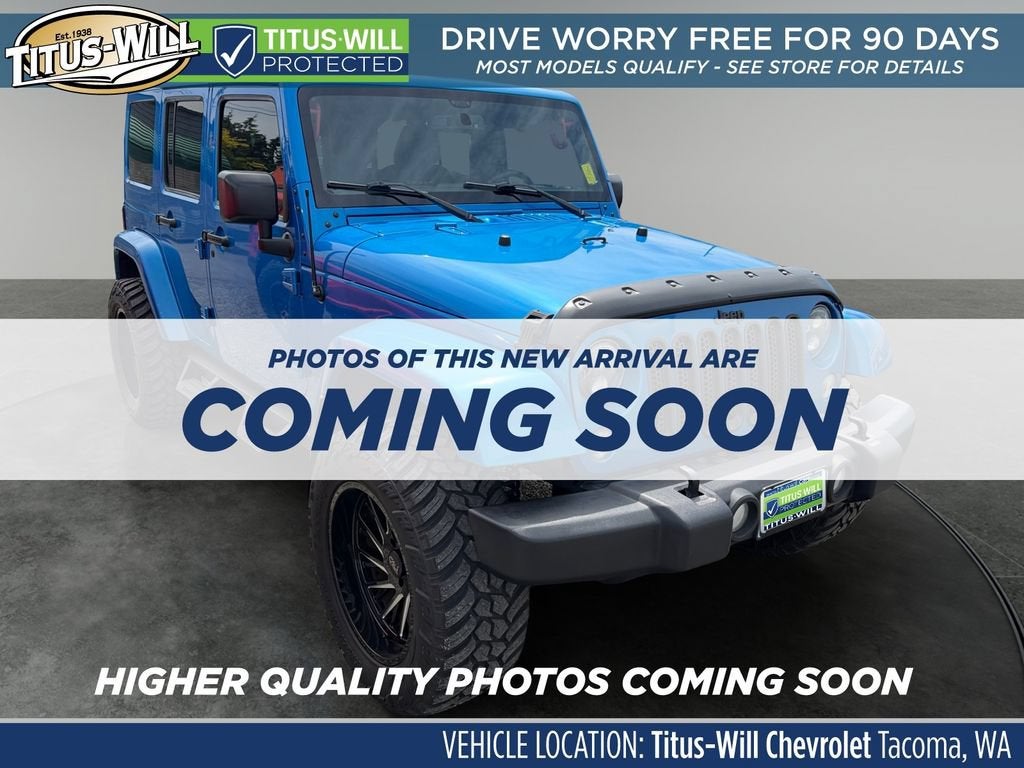 2015 Jeep Wrangler Unlimited Sahara in Blue — front three-quarter view