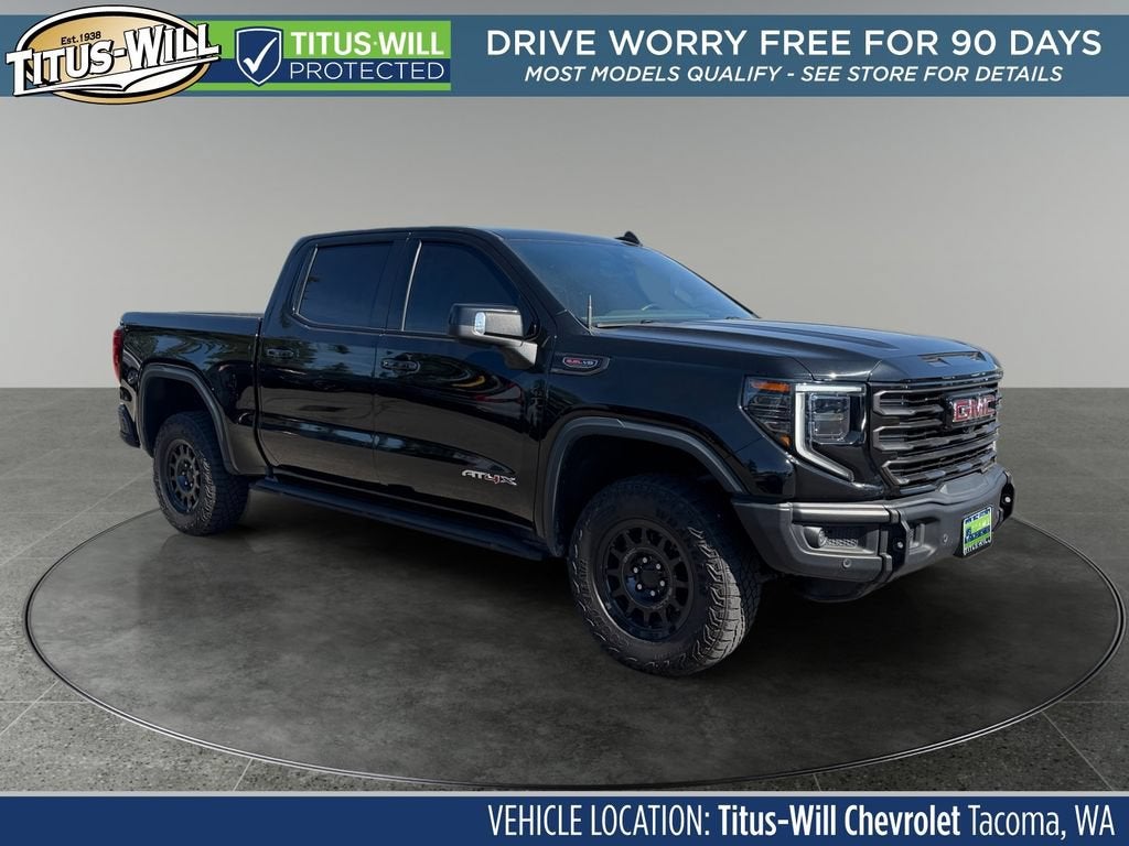 2023 GMC Sierra 1500 AT4X in Onyx Black — front three-quarter view