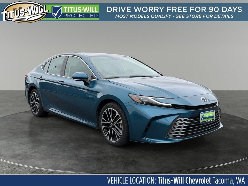 2025 Toyota Camry LE in Blue — front three-quarter view