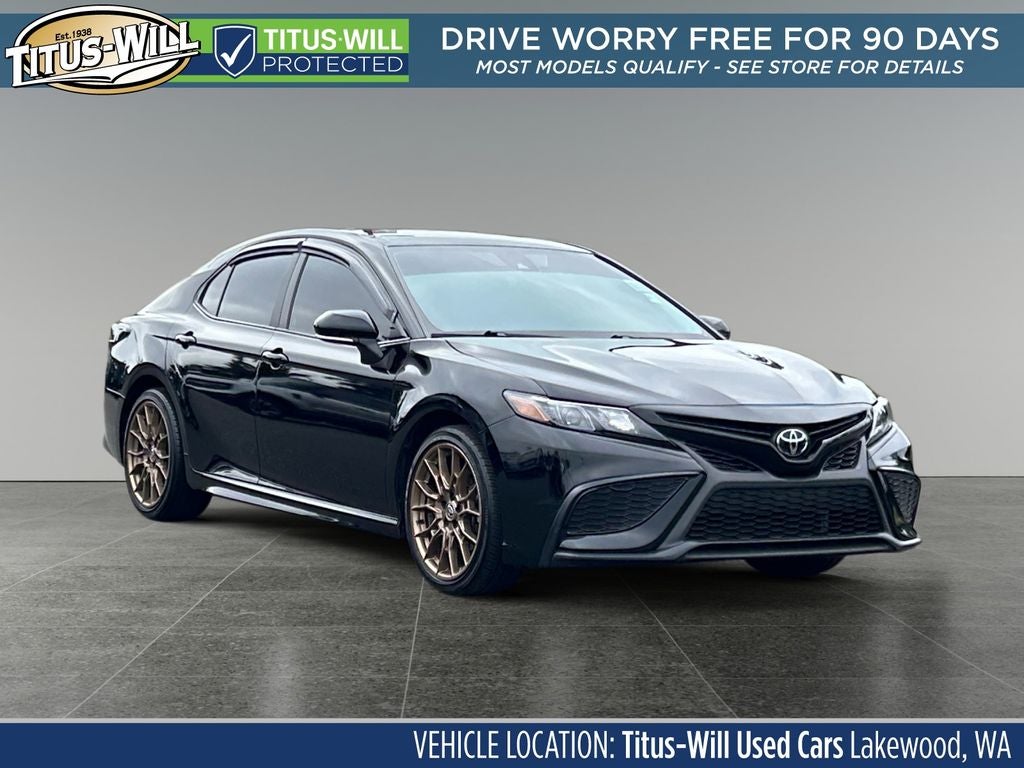 2023 Toyota Camry SE Nightshade in Midnight Black Metallic — front three-quarter view