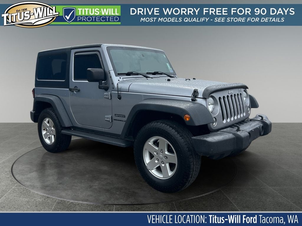 2016 Jeep Wrangler Sport in Billet Silver Metallic — front three-quarter view