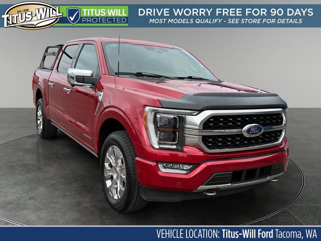 2023 Ford F-150 Platinum Hybrid in Rapid Red Metallic Tinted Clearcoat — front three-quarter view