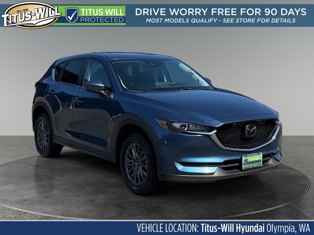 2021 Mazda Mazda CX-5 Touring AWD in Eternal Blue Mica — front three-quarter view