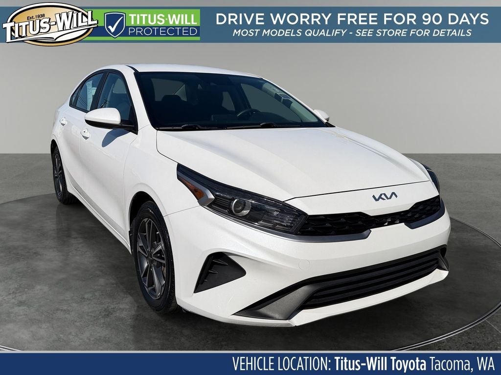 2023 Kia Forte LXS in Snow White Pearl — front three-quarter view