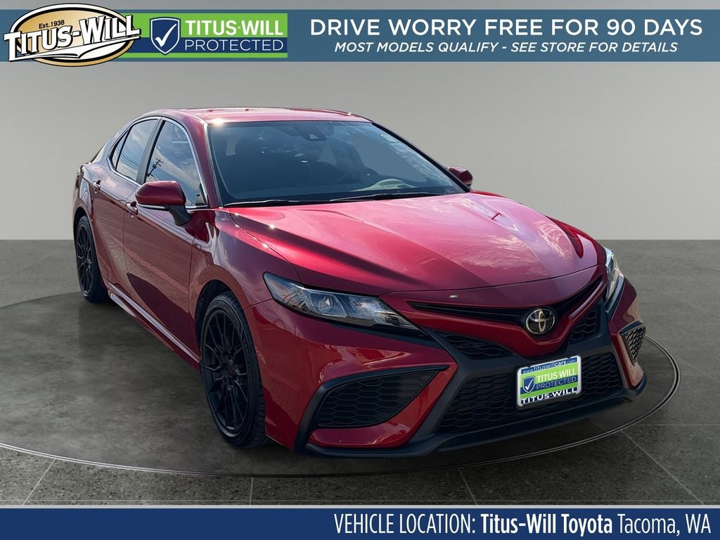 2023 Toyota Camry SE in Supersonic Red — front three-quarter view