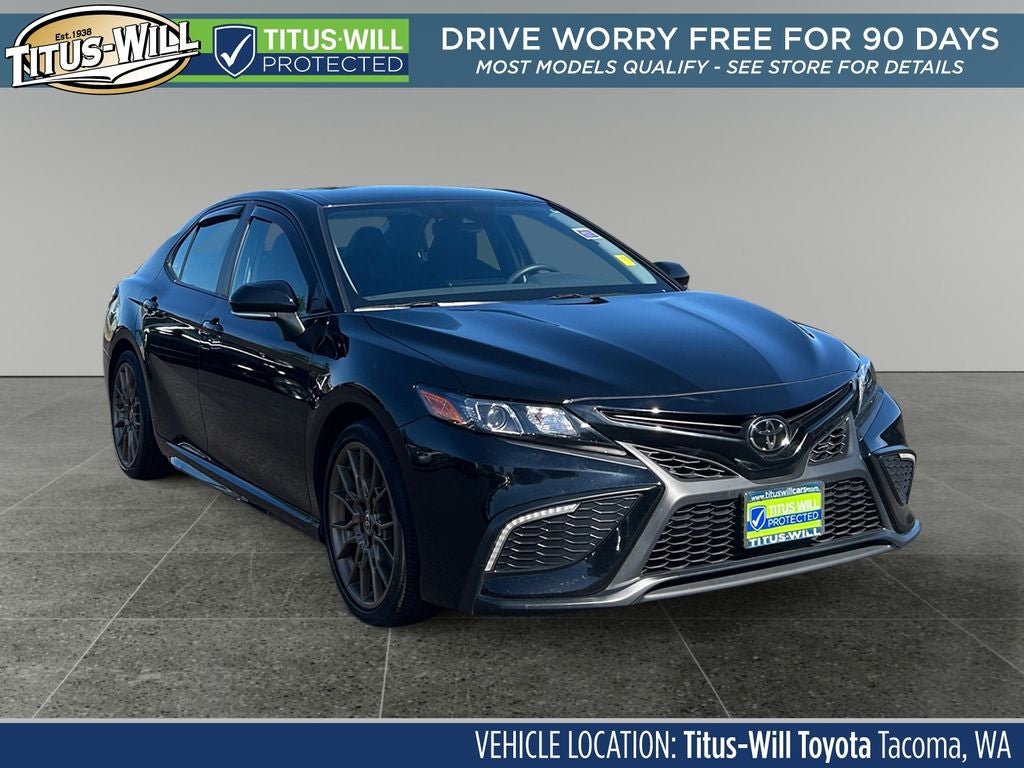 2024 Toyota Camry SE Nightshade in Midnight Black Metal — front three-quarter view