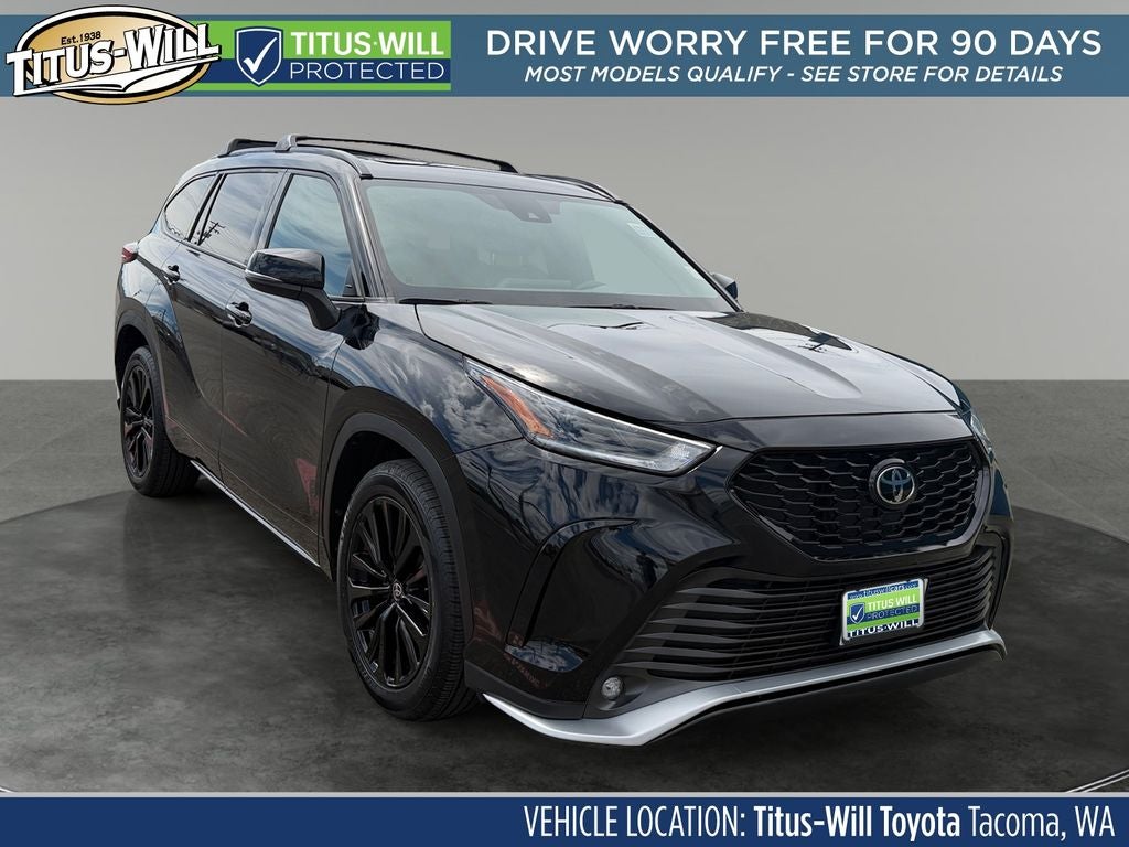 2023 Toyota Highlander XSE in Midnight Black Metal — front three-quarter view
